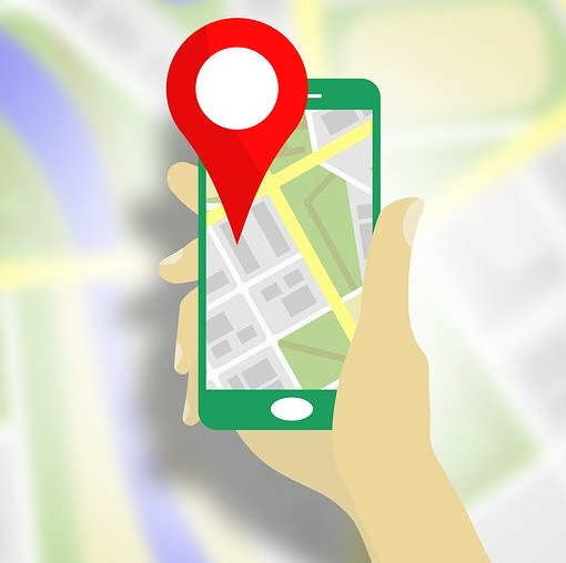 A drawing of a person looking for a location via GPS using a mobile app.